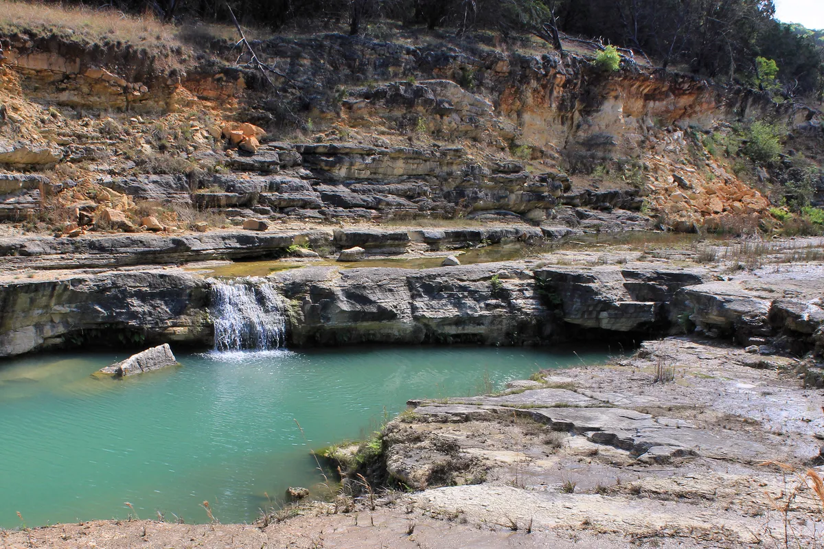Limestone ledges and a small waterfall at the Canyon Lake Gorge